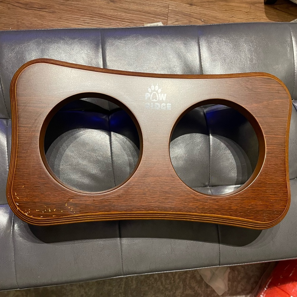 Elevated Pet Feeder Solid Wood Stand but no dishes included!  The opening is 5”
